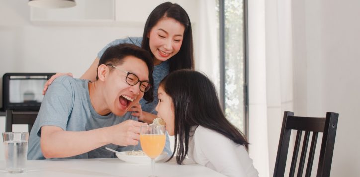 asian-japanese-family-has-breakfast-home-asian-happy-dad-mom-daughter-eat-spaghetti-drink-orange-juice-table-modern-kitchen-house-morning-2